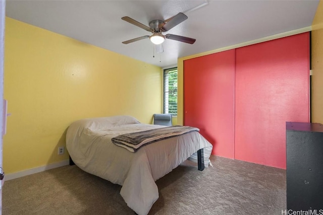 bedroom with dark carpet and ceiling fan