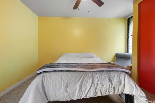 bedroom featuring ceiling fan and carpet flooring