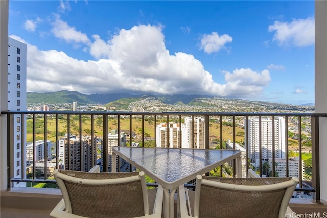 balcony featuring a mountain view