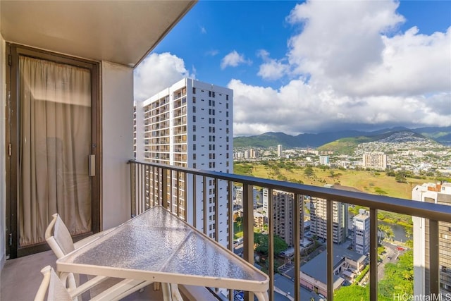 balcony featuring a mountain view