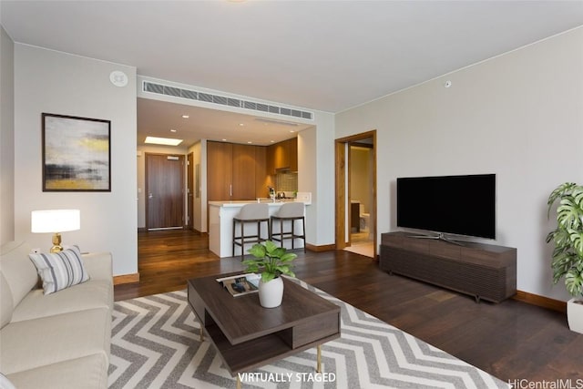 living room featuring dark hardwood / wood-style flooring