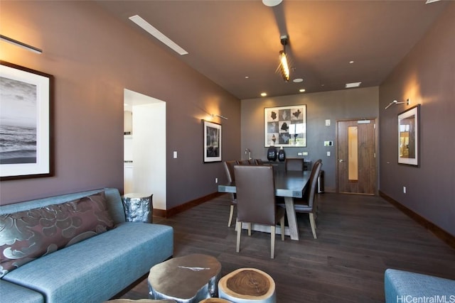 dining area featuring dark wood-type flooring