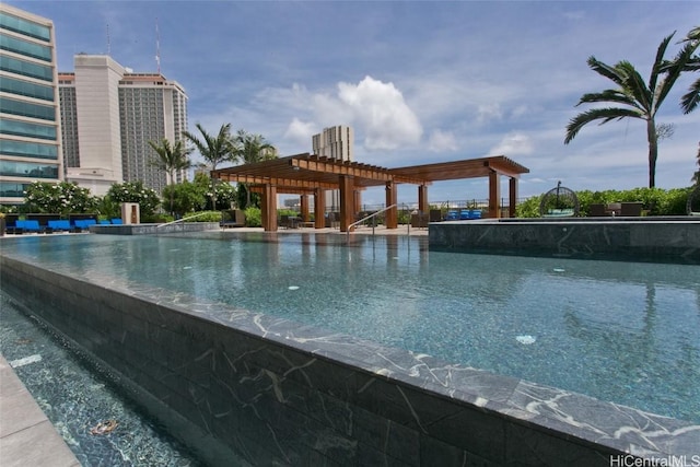 view of swimming pool featuring a pergola