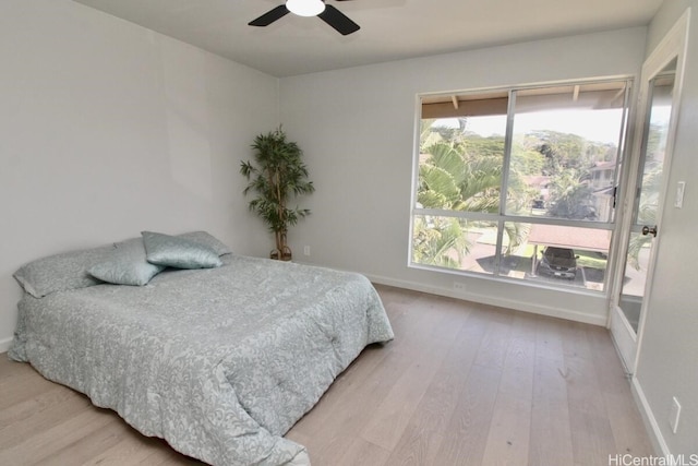 bedroom featuring light hardwood / wood-style floors and ceiling fan