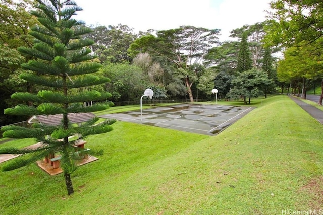 view of community with a yard and basketball court