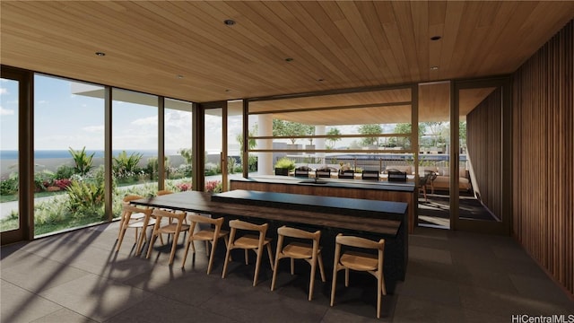 sunroom featuring plenty of natural light and wooden ceiling