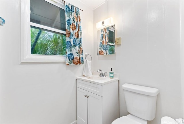 bathroom featuring vanity and toilet