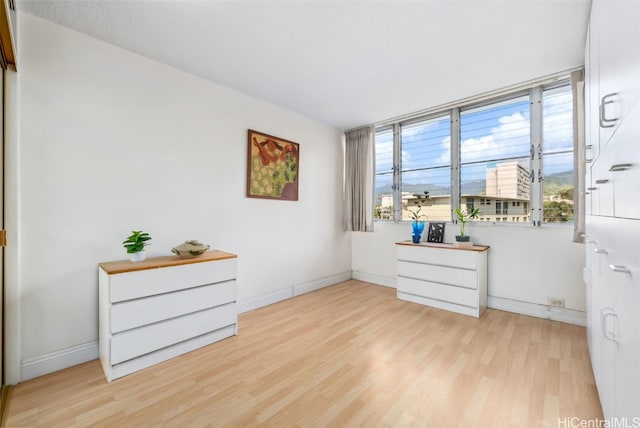 interior space with light wood-type flooring and baseboards