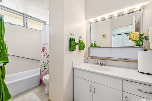 bathroom with shower / bath combo with shower curtain, vanity, toilet, and tile patterned floors