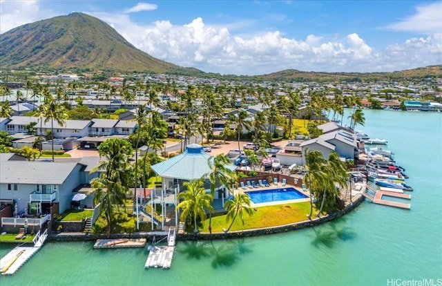 birds eye view of property featuring a water and mountain view