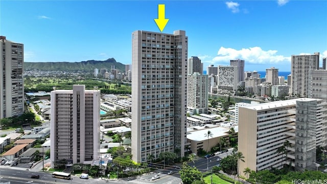 property's view of city with a mountain view