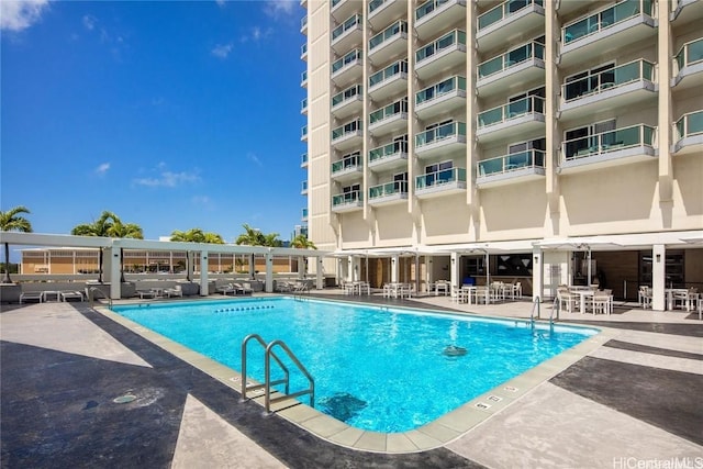 view of pool featuring a patio