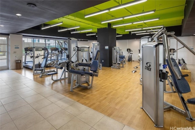 gym with light hardwood / wood-style floors