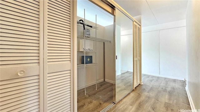 corridor featuring light hardwood / wood-style floors