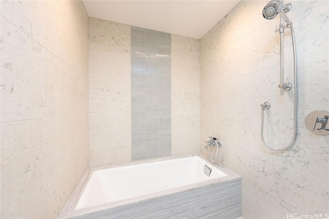 bathroom featuring tile walls