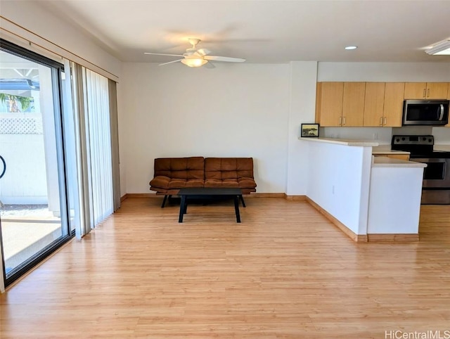 interior space with light hardwood / wood-style flooring and ceiling fan