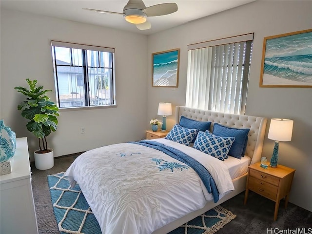 bedroom featuring dark carpet and ceiling fan