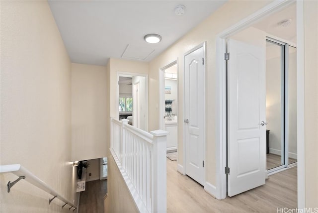 corridor with light wood-type flooring