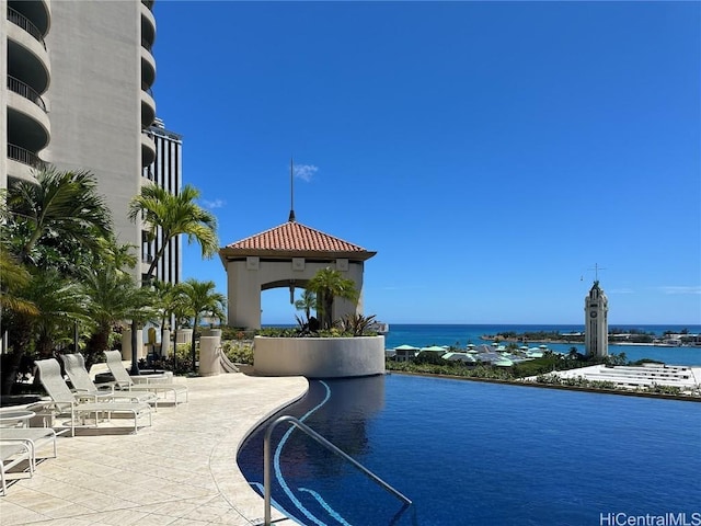 exterior space with a patio and a water view