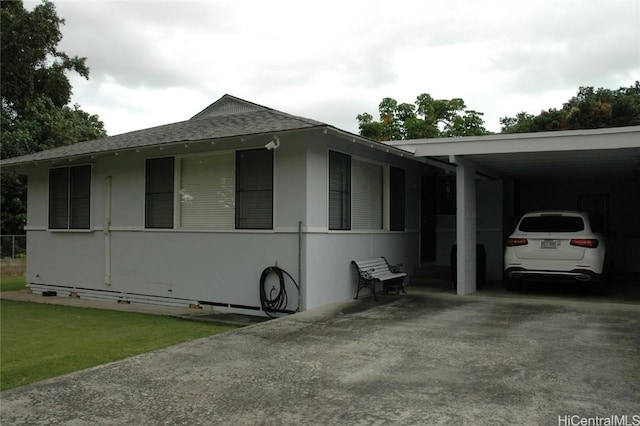 view of side of home with a carport