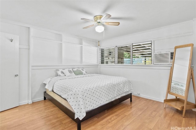 bedroom with ceiling fan and light wood-type flooring