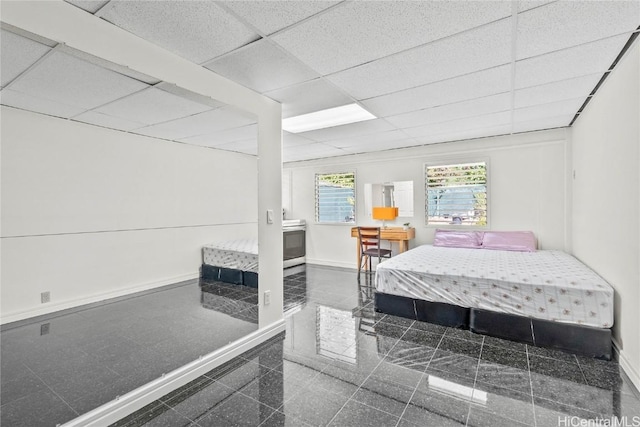 bedroom with a paneled ceiling