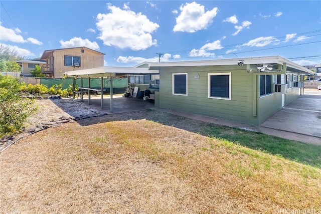 exterior space with cooling unit and a carport