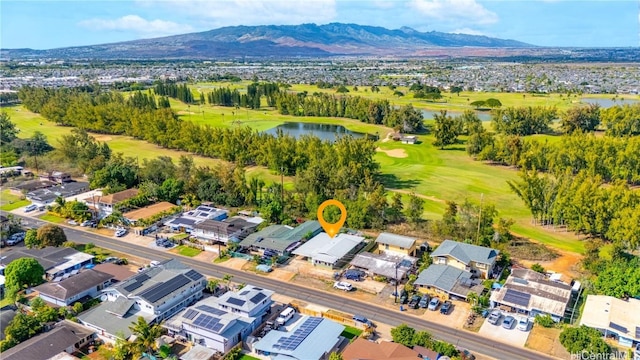 drone / aerial view with a water and mountain view