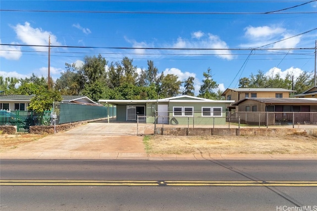 single story home with a carport