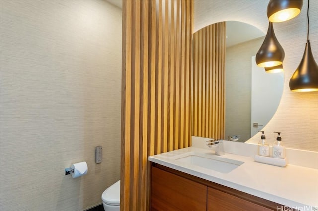 bathroom with vanity and toilet