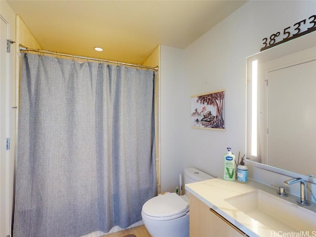 bathroom with vanity and toilet