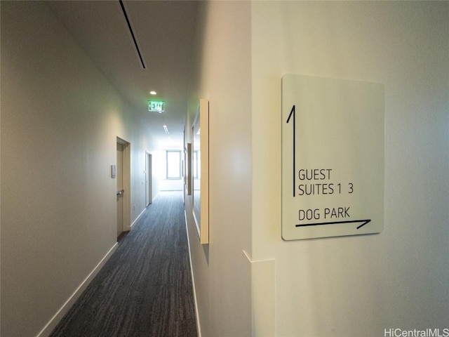 corridor with dark hardwood / wood-style floors