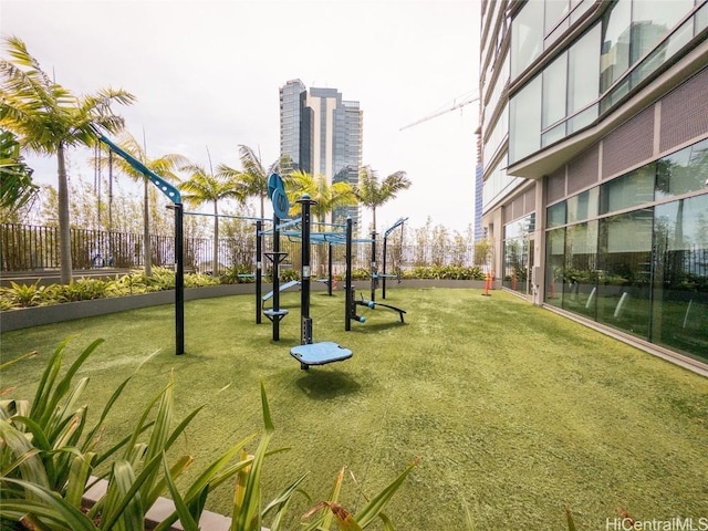 surrounding community featuring a yard and a playground