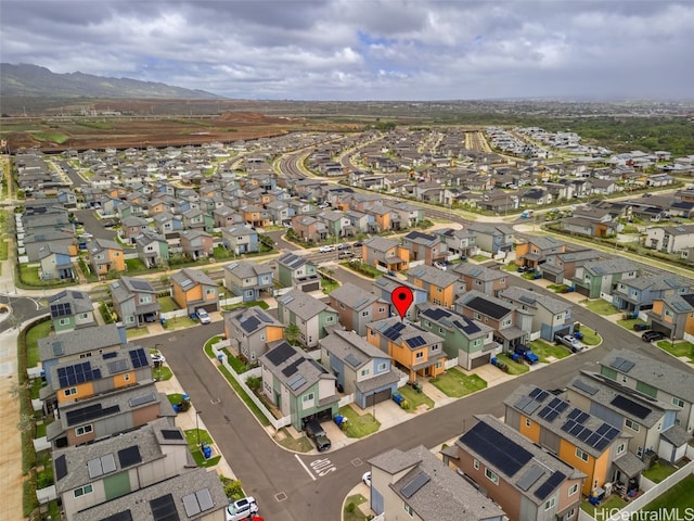 birds eye view of property with a mountain view