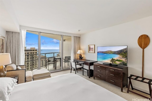 bedroom featuring floor to ceiling windows, access to outside, and light colored carpet