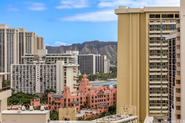 property's view of city featuring a mountain view