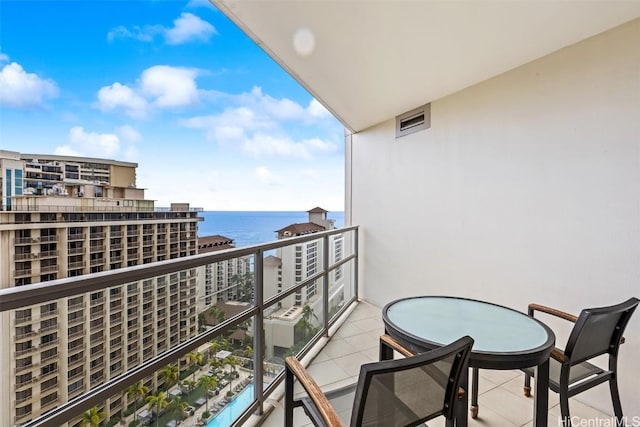 balcony featuring a water view