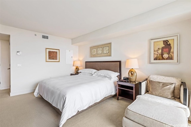 bedroom with light colored carpet