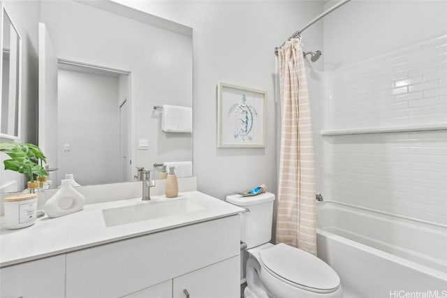 full bathroom with vanity, toilet, and shower / tub combo