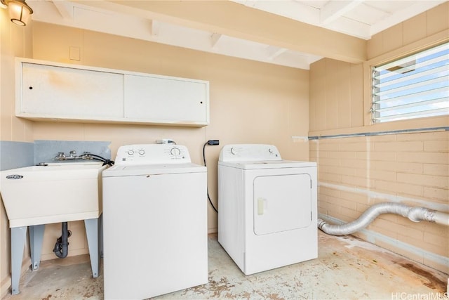 laundry room featuring separate washer and dryer and sink