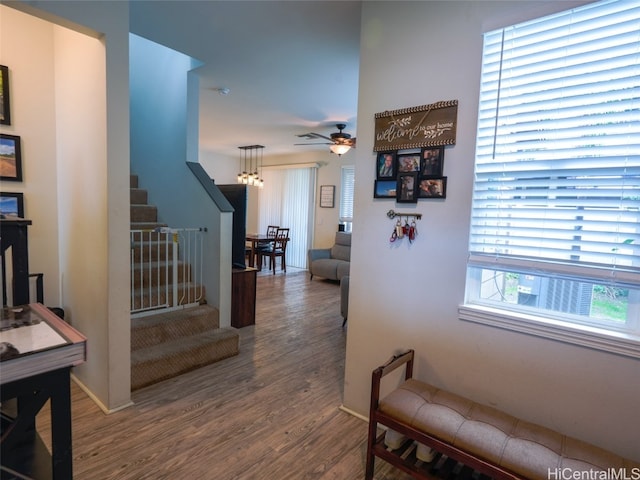 corridor with hardwood / wood-style flooring