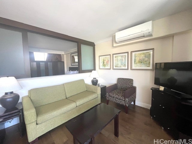 living room with dark wood-type flooring, ornamental molding, and an AC wall unit