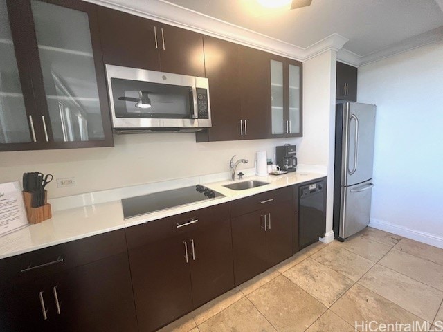 kitchen with ornamental molding, sink, dark brown cabinetry, and black appliances