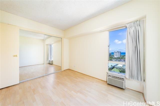 unfurnished room featuring hardwood / wood-style floors