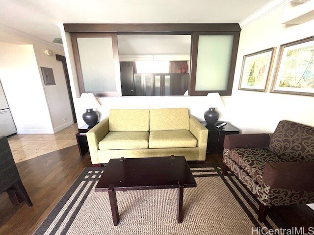255 Beach Walk Unit 45, Honolulu, HI 96815 - living room with crown molding and wood-type flooring