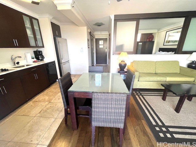 255 Beach Walk Unit 45, Honolulu, HI 96815 - dining room with crown molding and sink
