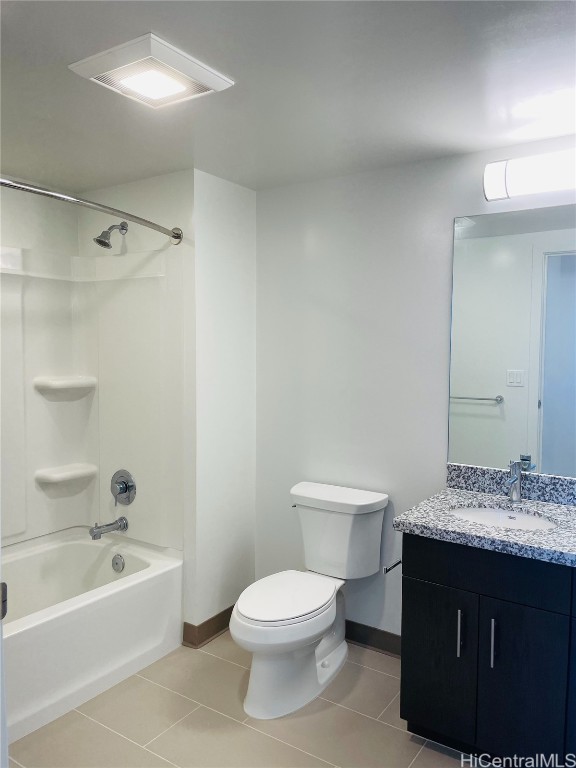 full bath with vanity, baseboards, tile patterned flooring, bathing tub / shower combination, and toilet