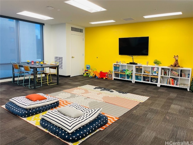 rec room featuring carpet flooring