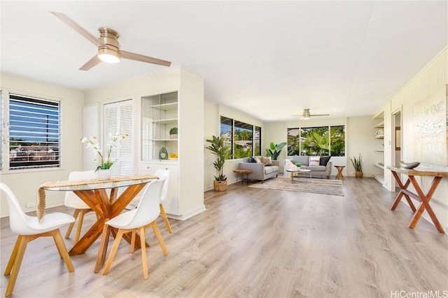 dining space featuring ceiling fan and light hardwood / wood-style floors