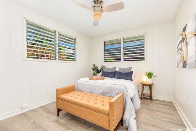 bedroom with ceiling fan and light wood-type flooring